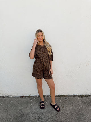 Woman modeling a leopard romper