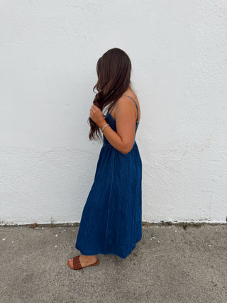Woman modeling a denim midi dress