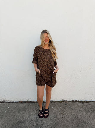 Woman modeling a leopard romper