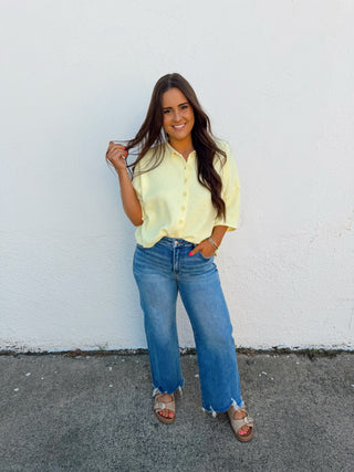 Woman modeling a yellow top