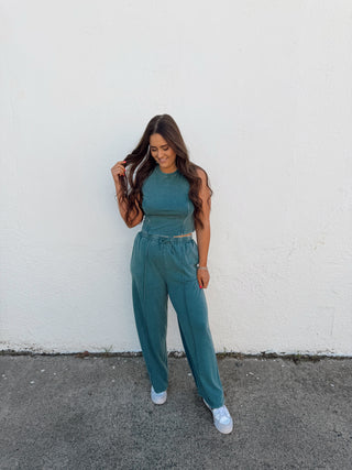 Woman modeling a teal green set