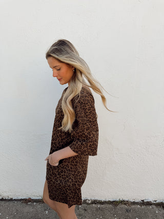 Woman modeling a leopard romper