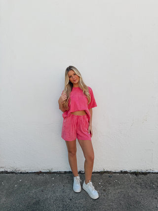 Woman modeling a pink set