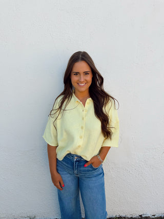Woman modeling a yellow top