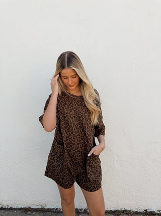 Woman modeling a leopard romper