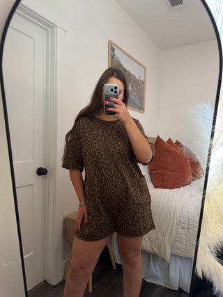 Woman modeling a leopard romper