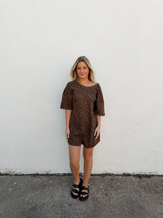 Woman modeling a leopard romper