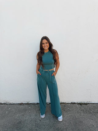 Woman modeling a teal green set