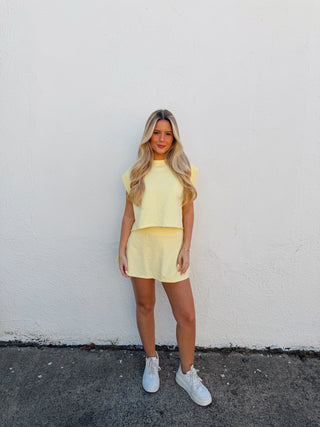 Woman modeling a yellow set