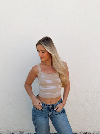 Woman modeling a sand and cream stripe tank