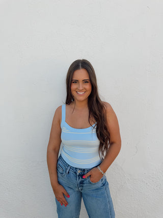 Girl modeling a stripe tank