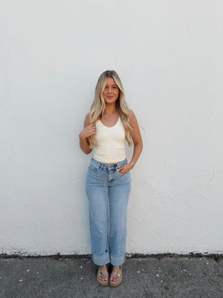 Girl modeling floral denim and a tank