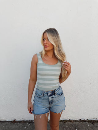 Girl modeling a stripe tank