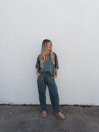 Girl modeling.a teal green set