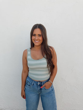 Girl modeling a stripe tank